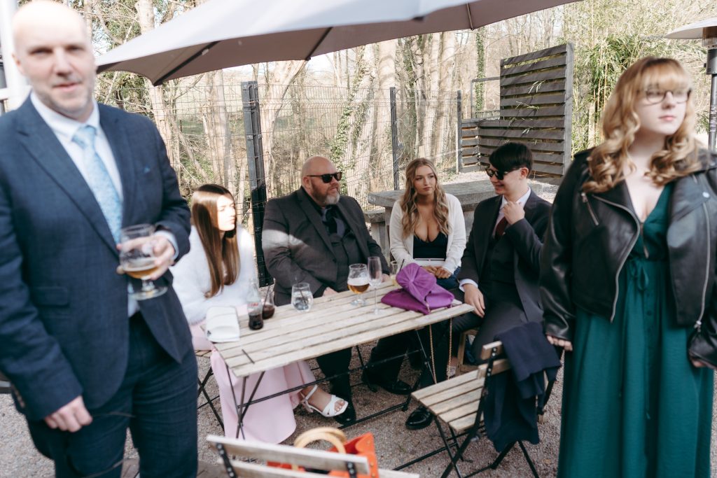 Beth & Rob's wedding at Carwinley Barn, Cumbria — drinks, confetti, everyone talking at once