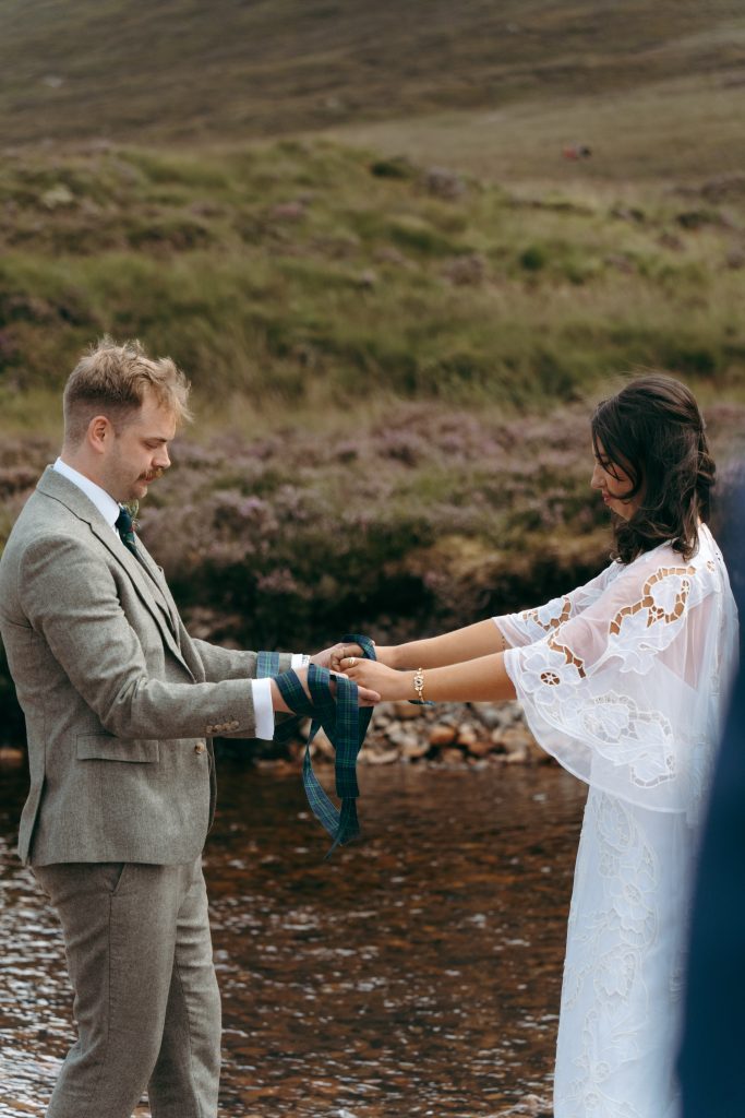 Mike & Hev's wedding at The Wee White House, Glencoe — drinks, confetti, everyone talking at once