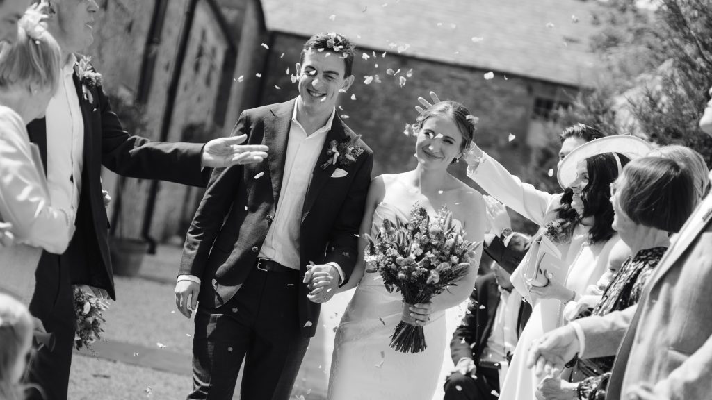 Caitlin & Tom's wedding at Doxford Barns, Northumberland — confetti, drinks and happy reunions
