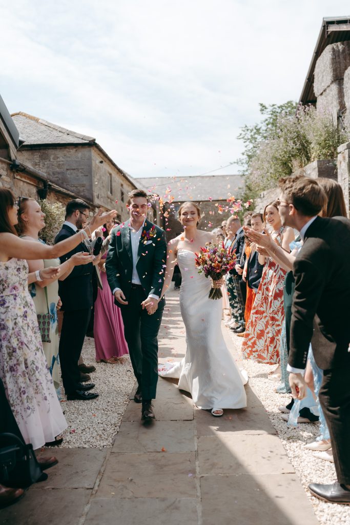 Caitlin & Tom's wedding at Doxford Barns, Northumberland — confetti, drinks and happy reunions