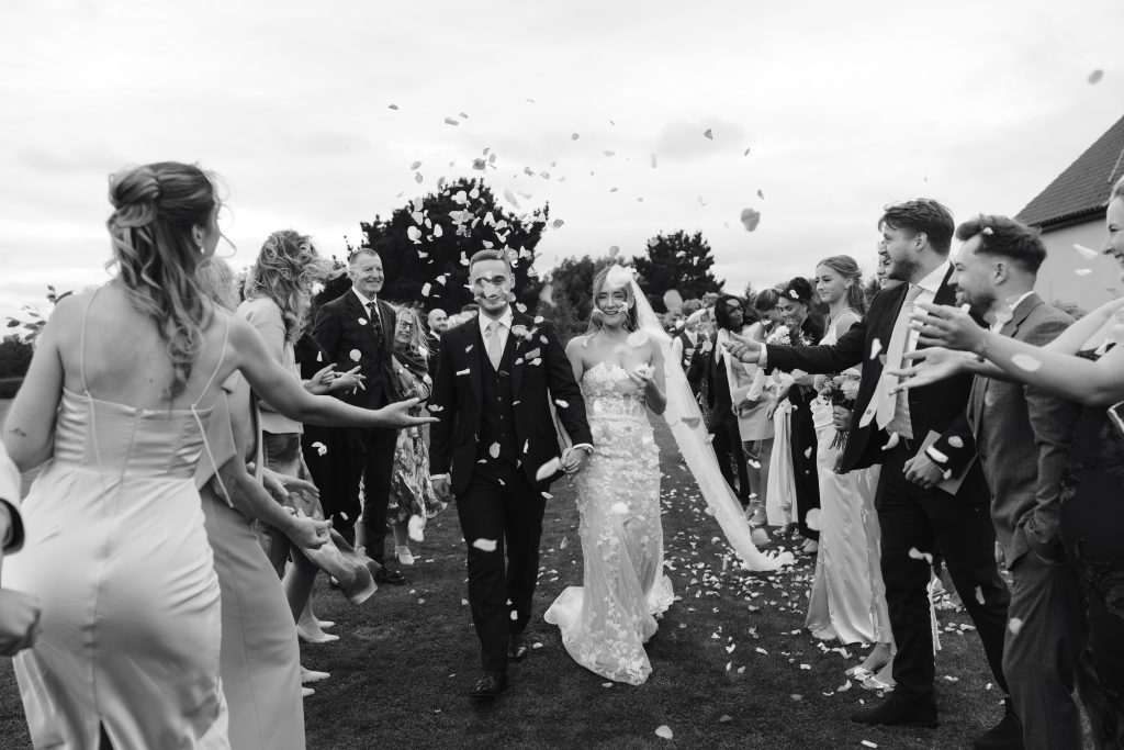 Libby & Tyler's wedding at The Hidden Oak, County Durham — confetti, drinks and guests socialising