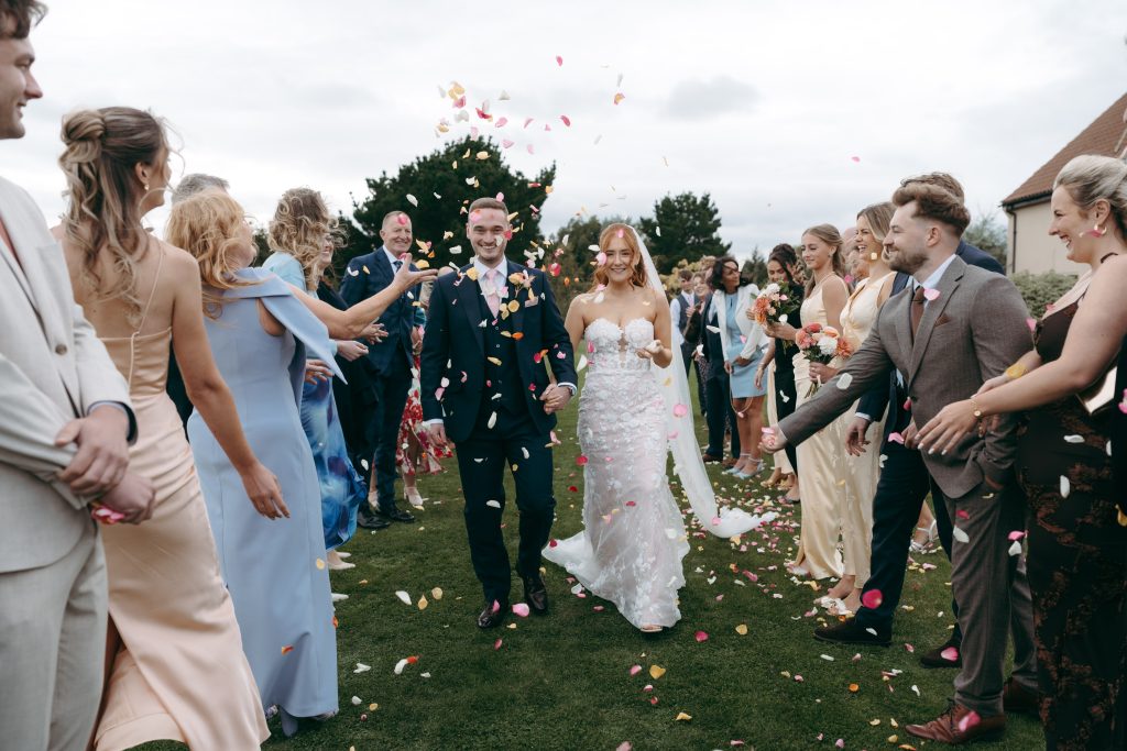 Libby & Tyler's wedding at The Hidden Oak, County Durham — confetti, drinks and guests socialising