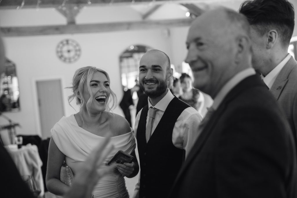 Libby & Tyler's wedding at The Hidden Oak, County Durham — confetti, drinks and guests socialising