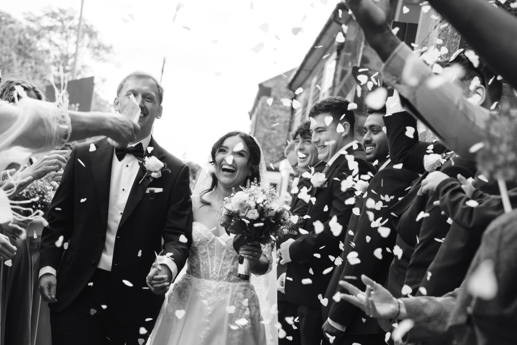 Monique & Taylor's wedding at Teeside Vineyard Church — drinks, confetti, everyone talking at once
