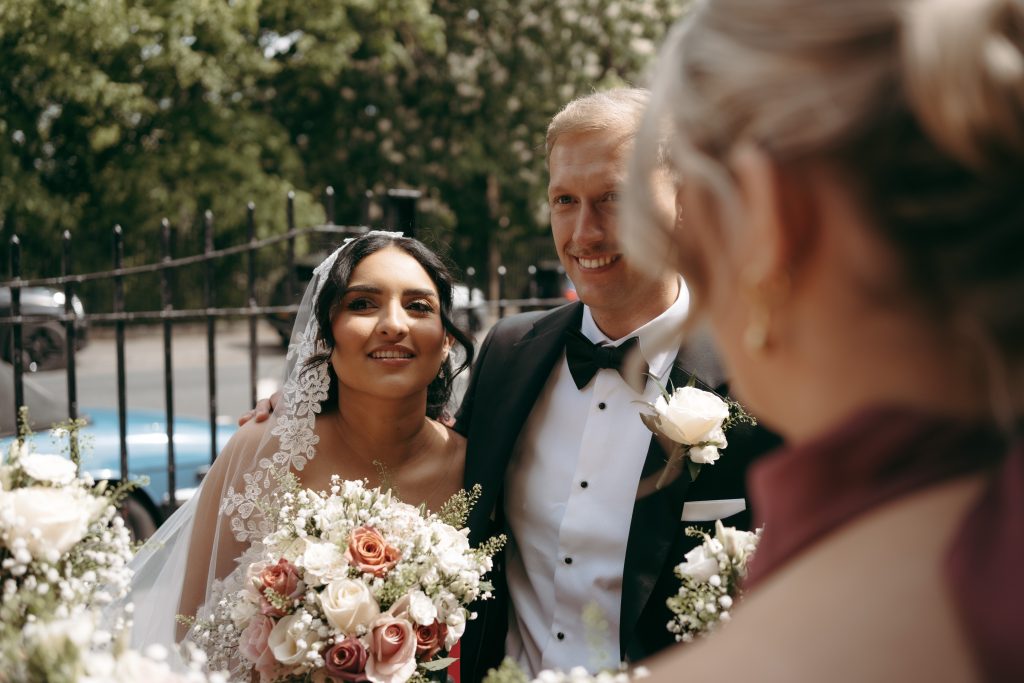 Monique & Taylor's wedding at Teeside Vineyard Church — drinks, confetti, everyone talking at once