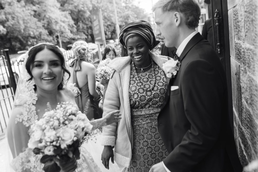 Monique & Taylor's wedding at Teeside Vineyard Church — drinks, confetti, everyone talking at once